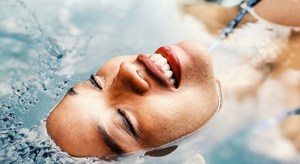 Woman floating and happy. If you're a busy mom, black women, and working professional, finding time for self-care matters. Learn from skilled online therapy how you can take some helpful self-care tips in Detroit, MI and incorporate them into your life. If you need support, begin online therapy in Michigan soon!