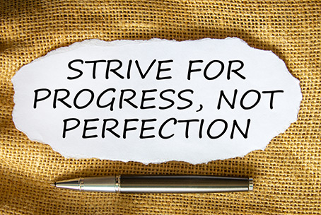 Quote saying " strive for progress, not perfection. Its time to give yourself grace. Learn tips for overcoming perfectionism in Detroit, MI. We offer therapy for anxiety and perfectionism. Call now and begin moving forward!
